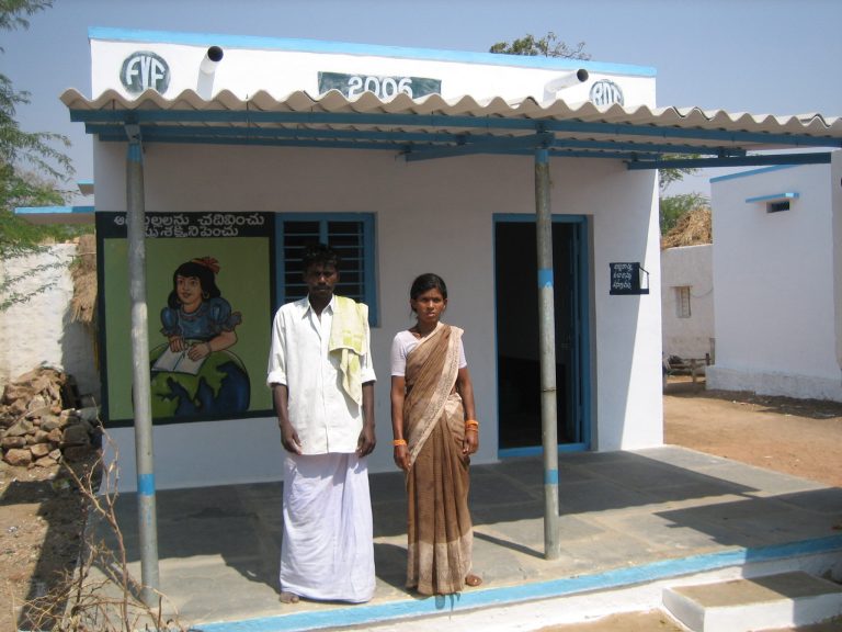 A family in front of their new home. Source: Vicente Ferrer Foundation