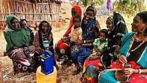 Group of families enjoying their radio in Marsabit. Source: Lifeline Energy