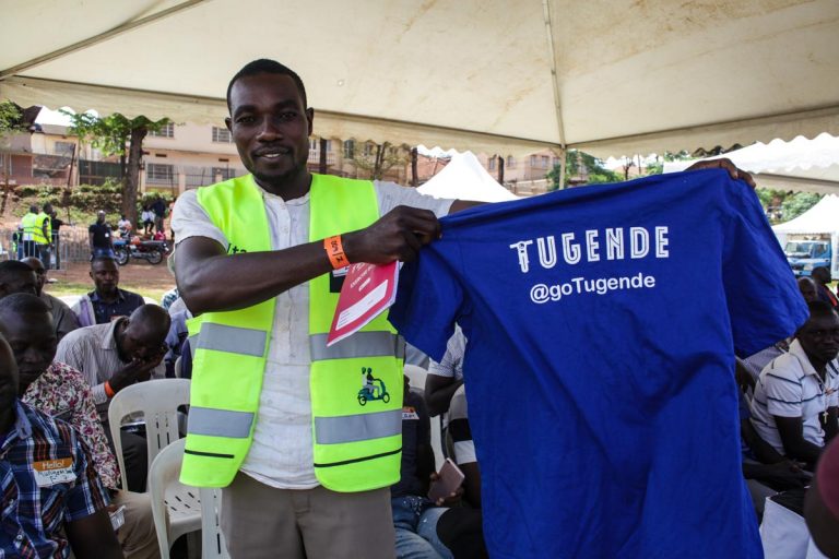 Customer with shirt. Source: Tugende