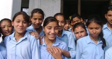 Students in front of one of the classrooms. Source: Room to Read