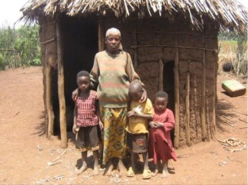 A mother and her three children in front of her shack. Source: Trust and Care