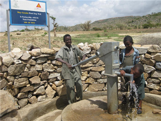 One of the wells in full operation. Source: A Glimmer of Hope