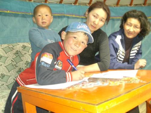 A young student with his family in the new house. Source: Christina Noble Children’s Foundation