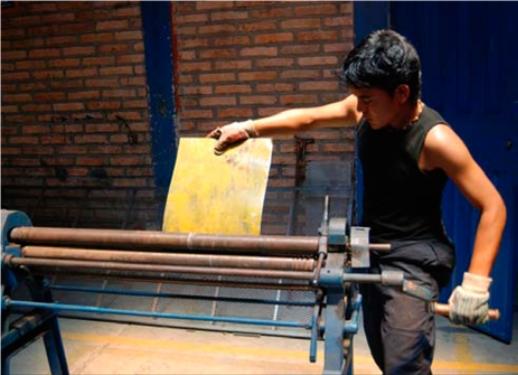 A young man is trained in preparing the pasta. Source: Our Little Brothers Foundation