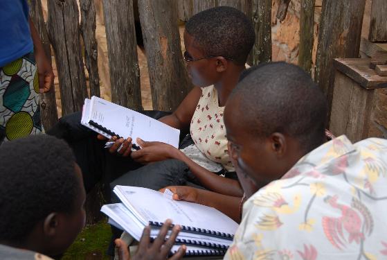 Teachers receive and review donated material. Source: G3T Foundation