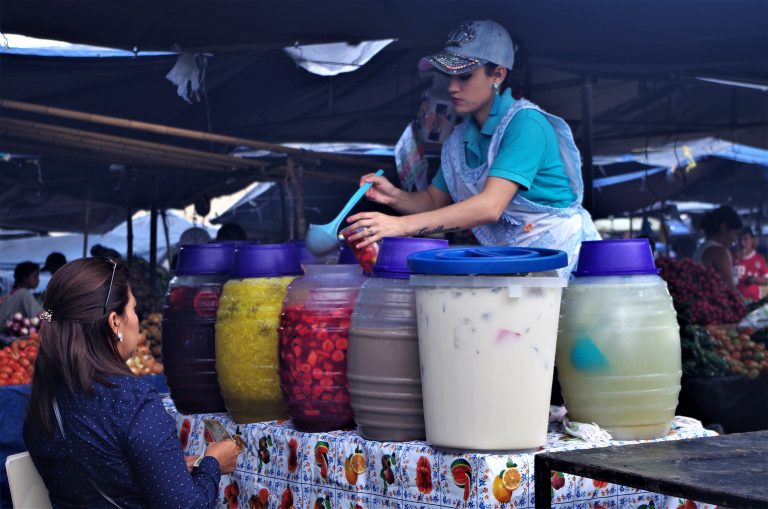 Woman selling fresh water at a local market. Source: Herbert Adolfo Soriano