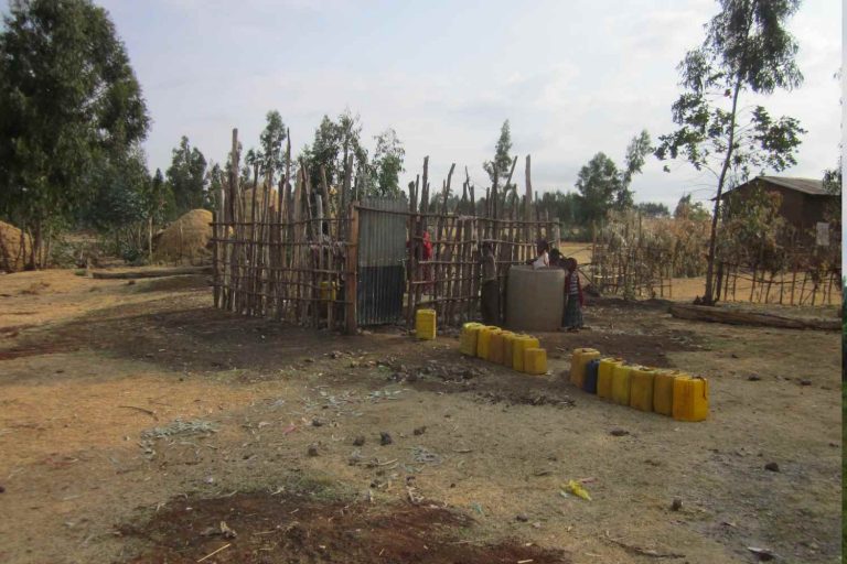 Exterior view of a well. Source: A Glimmer of Hope