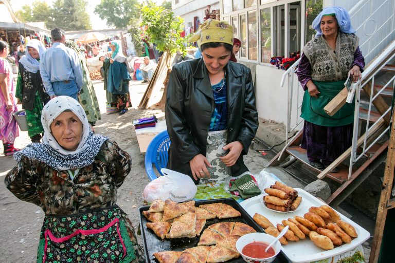 Women selling bread in the market. Source: Paparazzza