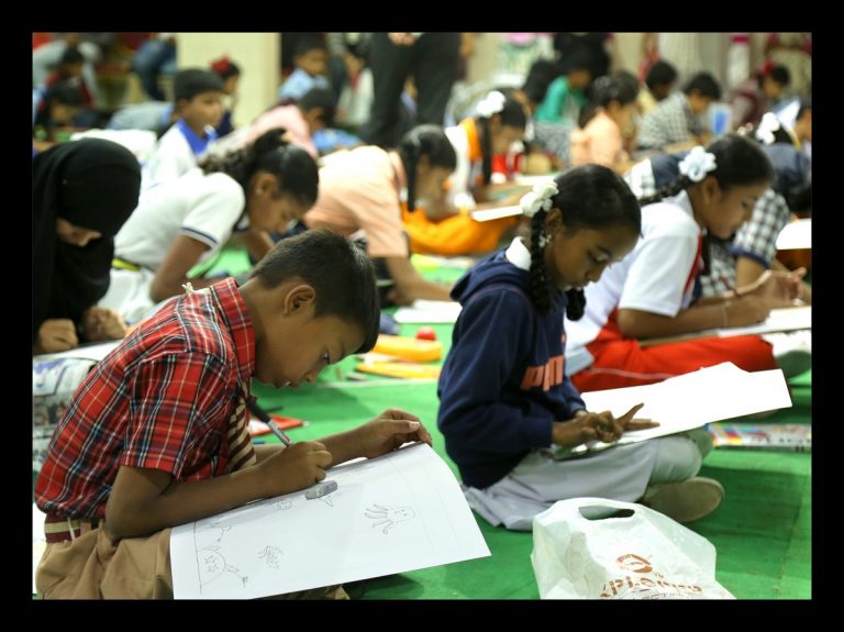 Students reading in a classroom Source: Jayakumar