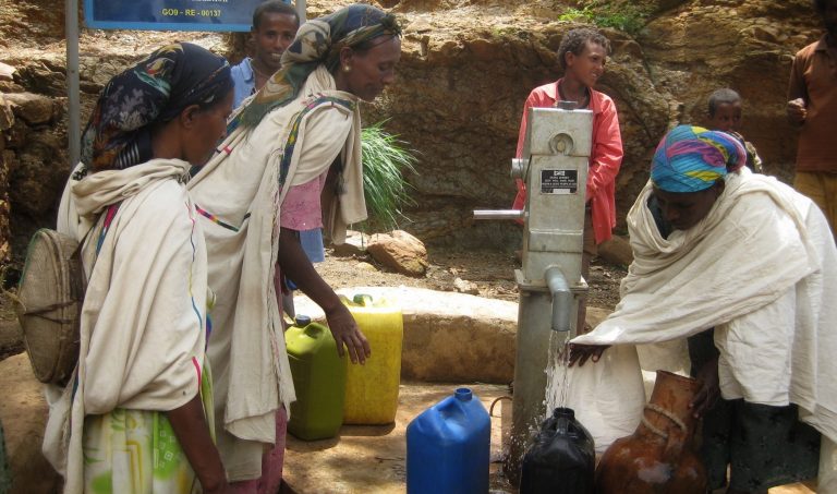 Collecting drinking water. Source: A Glimmer of Hope