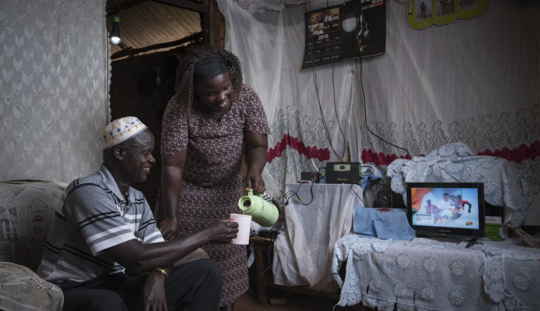 At home using solar energy system. Source: M-KOPA Kenya