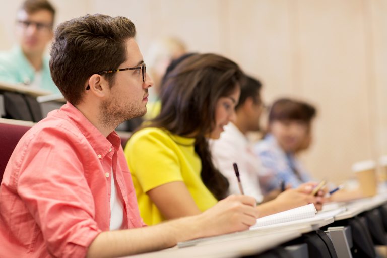 Group of students attending a class. Source: Syda Productions