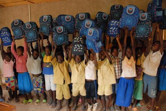 Elementary students with their backpacks. Source: Trust and Care