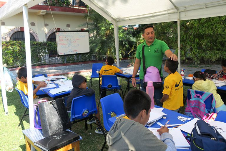 Classes in the garden until the classrooms are renovated. Source: Our Little Brothers Foundation