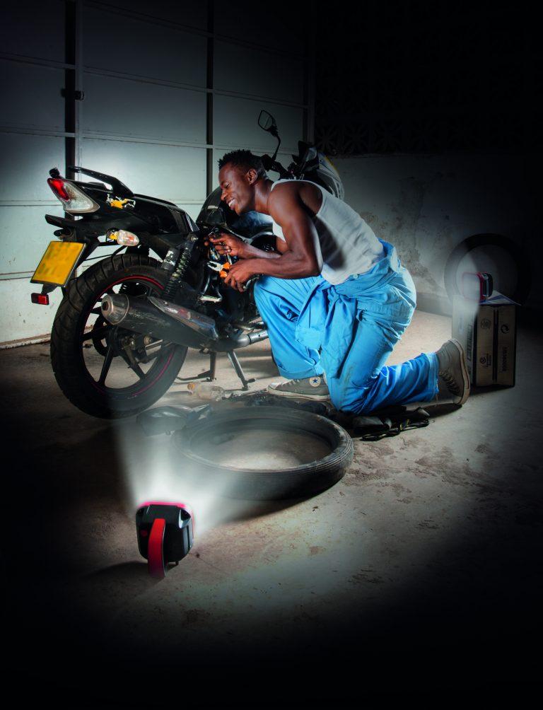 Mechanic using his sunlight to work. Source: SIMA