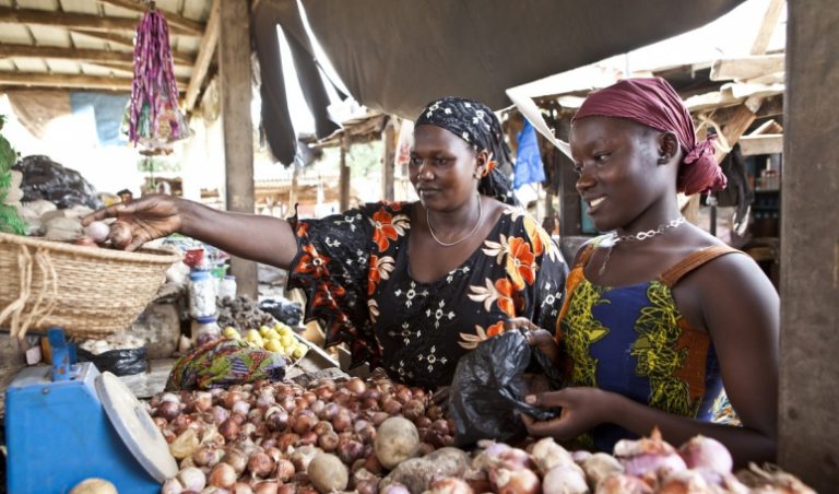 Entrepreneurs selling their products in a market. Source: Première Agence de Microfinance en Côte d'Ivoire (PAMF)